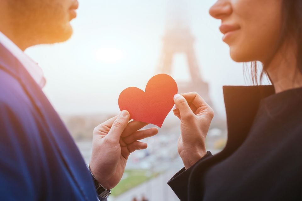 love and romance, couple on honeymoon near Eiffel Tower in Paris, heart for Valentines day